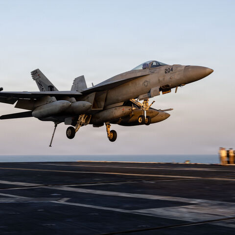  In this US Navy released handout, an F/A-18E Super Hornet, attached to Strike Fighter Squadron (VFA) 14, prepares to make an arrested landing on the flight deck of Nimitz-class aircraft carrier USS Abraham Lincoln (CVN 72) in support of Operation Epic Fury on March 1, 2026 at Sea. 