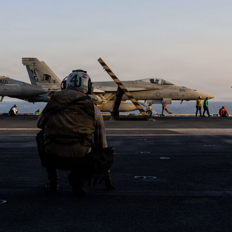 In this US Navy released handout, an F/A-18E Super Hornet, attached to Strike Fighter Squadron (VFA) 14, prepares to take off from the flight deck of Nimitz-class aircraft carrier USS Abraham Lincoln (CVN 72) in support of Operation Epic Fury on March 1, 2026 at Sea. 