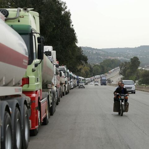 A long convoys of Iraqi diesel-laden tanker trucks line up along the highway Tartus-Baniyas highway as they wait to unload their cargo at the Baniyas port refinery on the Mediterranean Sea, on April 15, 2026.