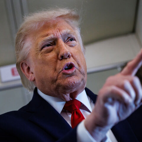 US President Donald Trump speaks with reporters while aboard Air Force One en route to Chippewa Falls, Wisconsin on June 5, 2026. 