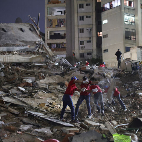 Responders arrive to a demolished building at San Bernardino after a magnitude 7.2 earthquake struck Venezuela and other regions in the Caribbean on June 24, 2026 in Caracas, Venezuela.