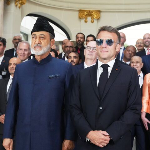 French President Emmanuel Macron (L) and Oman's Sultan Haitham bin Tarik pose during a meeting with business leaders in Paris on June 29, 2026. 