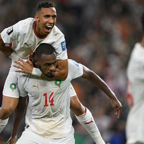 Morocco's defender #14 Issa Diop (R) celebrates scoring his team's first goal during the 2026 World Cup round of 32 football match between the Netherlands and Morocco at the Monterrey Stadium in Guadalupe on June 29, 2026. 