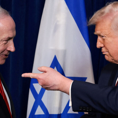 FILE PHOTO: U.S. President Donald Trump points his finger towards Israeli Prime Minister Benjamin Netanyahu during a press conference after meeting at Trump?s Mar-a-Lago club in Palm Beach, Florida, U.S., December 29, 2025. REUTERS/Jonathan Ernst/File Photo