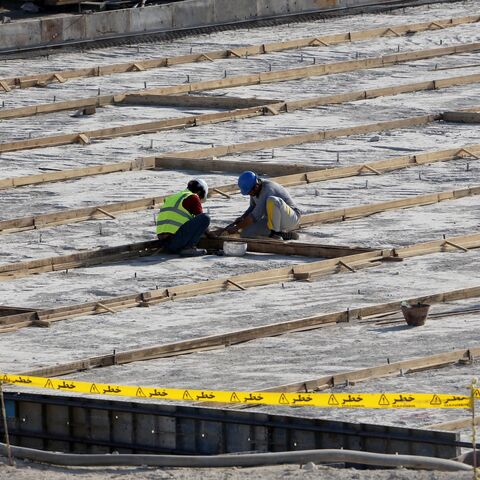 A picture taken on Nov. 10, 2019, shows workers on the construction site of a second reactor in Iran's Bushehr nuclear power plant, during an official ceremony to kick-start the works at the facility. 