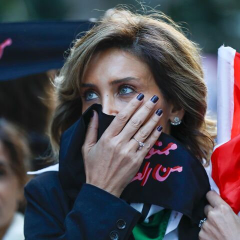 An activist takes part in a demonstration against sexual harassment, rape and domestic violence in the Lebanese capital Beirut on December 7, 2019. (Photo by ANWAR AMRO / AFP) (Photo by ANWAR AMRO/AFP via Getty Images)