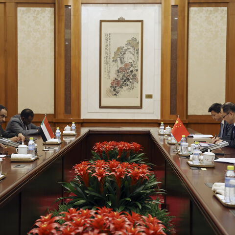 Chinese Foreign Minister Wang Yi (R) and Omar Siddig, Sudan's then-foreign minister, (L) attend a meeting during the China-CELAC Forum at Diaoyutai State Guest House on May 14, 2025 in Beijing, China.