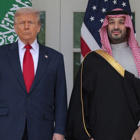President Donald Trump (L) and Crown Prince and Prime Minister Mohammed bin Salman of Saudi Arabia pause for photographs along the West Wing Colonnade at the White House on Nov. 18, 2025, in Washington.