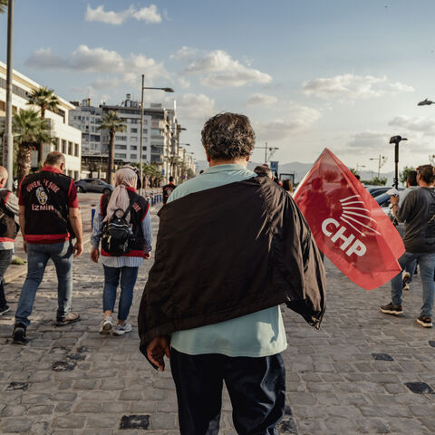 A demonstrator carries a CHP flag during a protest in Izmir, Turkey, on May 24, 2026. 