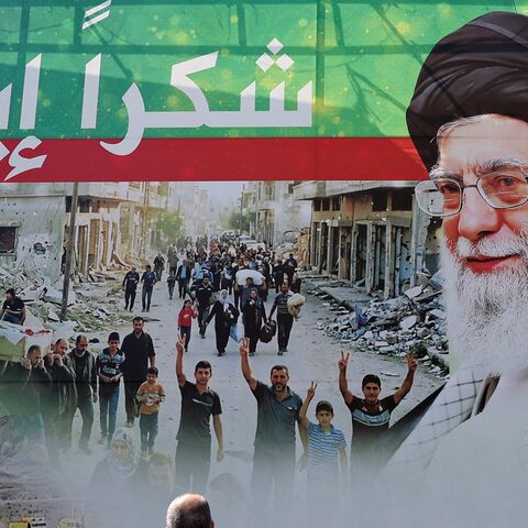 A giant billboard depicts late Iranian leader Ayatollah Ali Khamenei (2nd L), and his son Iranian Supreme Leader Ayatollah Mojtaba Khamenei, with Arabic writing that reads: "Thank you Iran," in Dahiyeh, Beirut's southern suburbs, on June 15, 2026. 
