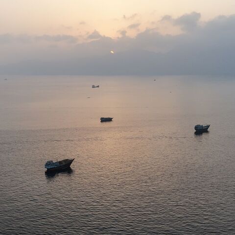 This aerial photograph shows boats anchored off Oman's northern Musandam Peninsula near the Strait of Hormuz on June 27, 2026. — AFP via Getty Images
