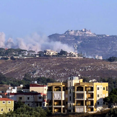 This photograph taken from the southern Lebanese city of Nabatieh shows smoke as it rises from the site of an Israeli-controlled explosion in the village of Kfar Tibnit, with the Beaufort citadel seen in the distance, July 13, 2026.
