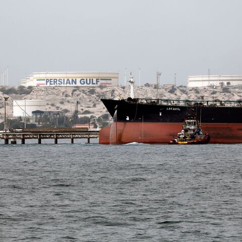 A picture taken on March 12, 2017, shows an Iranian tanker docking at the platform of the oil facility in the Khark Island, on the shore of the Gulf. 