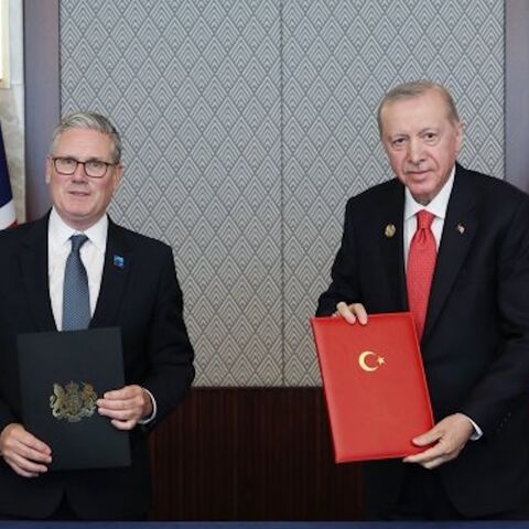 Britain's Prime Minister Keir Starmer (L) and Turkish President Recep Tayyip Erdogan pose after signing a defense partnership agreement on the sidelines of the NATO summit in Ankara, Turkey, Wednesday, July 8, 2026. 