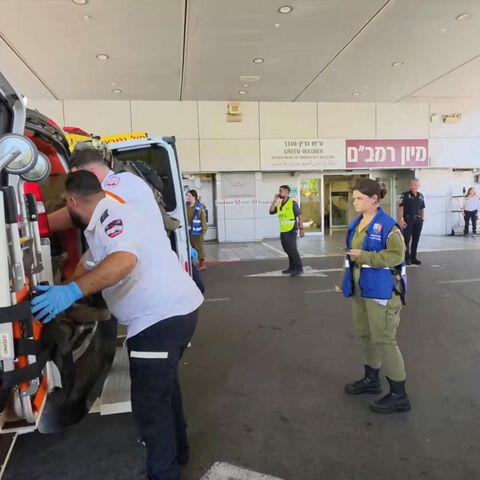 Paramedics work to move an Israeli casualty from inside an ambulance, after being wounded in an explosion in Lebanon, at Rambam Health Care Campus in Haifa, Israel, August 5, 2026. Rambam Health Care Campus/Handout via REUTERS