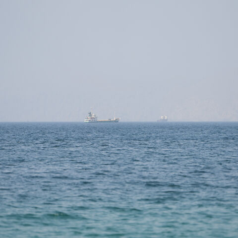 Vessels near the Strait of Hormuz, as seen from Musandam, Oman, August 6, 2026. REUTERS/Stringer