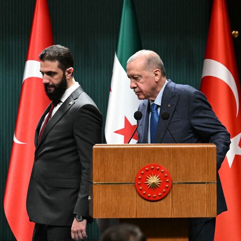 Turkish President Recep Tayyip Erdogan (R) and Syrian President Ahmed al-Sharaa arrive for a joint press conference following their meeting at the Presidential Palace in Ankara, Feb. 4, 2025.