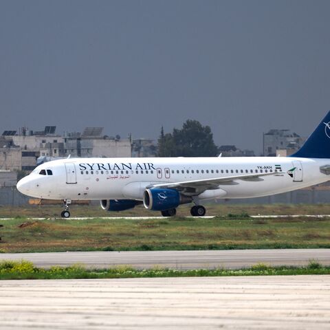 A Syrian Air passenger jet lands at Aleppo airport on March 18, 2025, the first aircraft to land after it was shut during the offensive that toppled former President Bashar al-Assad.