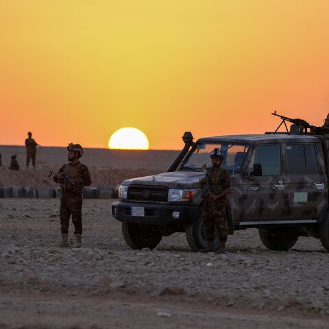 Iraqi army troops patrol the Iraq-Saudi Arabia border