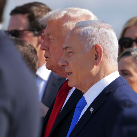 US President Donald Trump (C) is welcomed by Israeli Prime Minister Benjamin Netanyahu at Ben Gurion International Airport on Oct. 13, 2025 in Tel Aviv, Israel. 