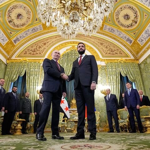 Russian President Vladimir Putin greets Syrian President Ahmed al-Sharaa at the Grand Kremlin Palace, Moscow, Oct. 15, 2025.