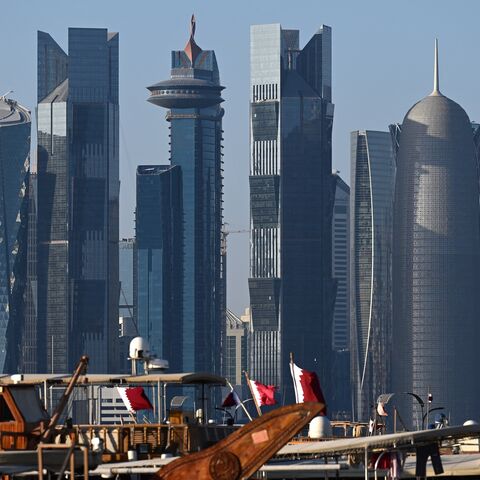 Traditional Qatari dhows docked in front of Doha's skyline from the Corniche promenade, Nov. 28, 2022.