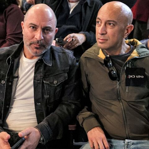  ISRAEL-ENTERTAINMENT-TELEVISION-POLITICS-GOVERNMENT-MASS-MEDIA-D (L to R) Lior Raz and Avi Issacharoff, co-creators of the hit Israeli TV show "Fauda", attend a demonstration against the Israeli government's plans to shut-down public broadcaster KAN, in Israel's Mediterranean coastal city of Tel Aviv on January 25, 2023. (Photo by JACK GUEZ / AFP) (Photo by JACK GUEZ/AFP via Getty Images)