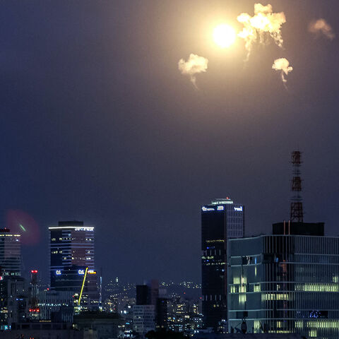TOPSHOT - Explosions from projectile interceptions by Israel's Iron Dome missile defence system are pictured over Tel Aviv on February 28, 2026. The United States and Israel launched strikes against Iran on February 28, with Israel's public broadcaster reporting that the Iranian supreme leader had been targeted, as the Islamic republic retaliated with barrages of missiles at Gulf states and Israel. (Photo by Jack GUEZ / AFP via Getty Images)