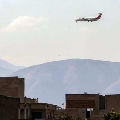 A Kish Air Airlines McDonnell Douglas MD-82 passenger aircraft prepares for landing at Tehran's Mehrabad Airport on June 20, 2026. — ATTA KENARE / AFP via Getty Images