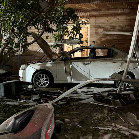 In this picture obtained by AFP from the Iranian news agency Tasnim on September 2, 2026 a destroyed vehicle is pictured at the site of an overnight strike in Kuhestak, Sirik County, in Iran's southern Hormozgan province on September 2, 2026. Iranian forces said on September 2 that they launched attacks on US military targets in the United Arab Emirates, Kuwait, Bahrain and other countries in the region, vowing "severe" consequences for renewed American attacks on the Islamic republic. (Photo by Masoud Moha