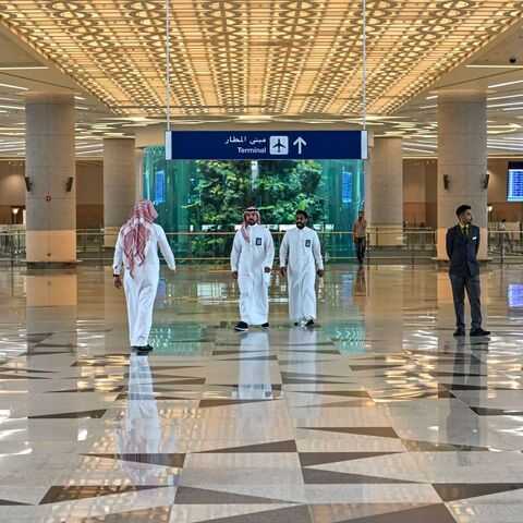 Men walk at a terminal at Saudi Arabia's King Abdulaziz International Airport in Jeddah on December 12, 2019. (Photo by GIUSEPPE CACACE / AFP) (Photo by GIUSEPPE CACACE/AFP via Getty Images)