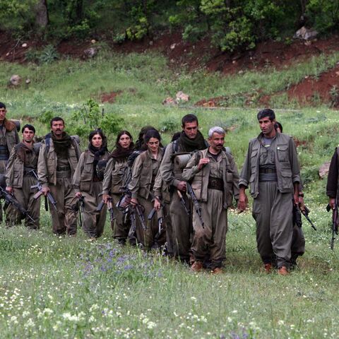 Kurdistan Workers Party (PKK) fighters arrive in the northern Iraqi city of Dohuk on May 14, 2013, after leaving Turkey as part of a peace drive with Ankara. 