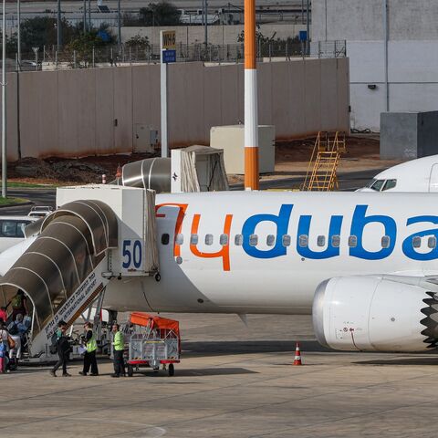 Passengers board a flydubai flight, bound for Dubai, before taking off from Ben Gurion Airport near Tel Aviv, on Sept. 30, 2026. 