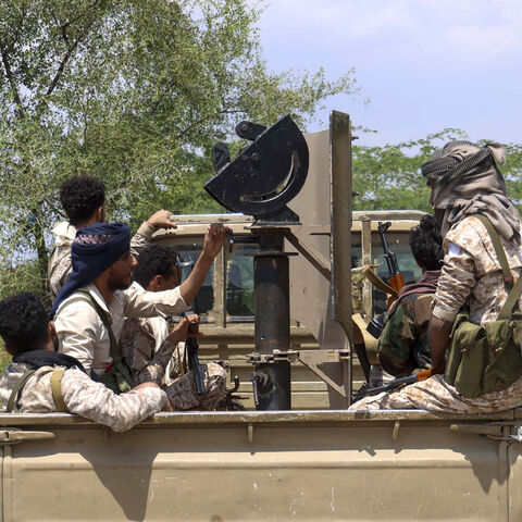 Saudi-backed Yemeni government forces ride in the back of a military truck at the Jabal Han front west of the city of Taiz following fierce battles earlier in the day as Yemen's Houthis reportedly attempted to seize control of the main route between the inland city of Taiz and the coastal city of Aden, on Oct. 3, 2026.  