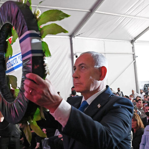 Israeli Prime Minister Benjamin Netanyahu lays a wreath during the state memorial ceremony for the third anniversary of the Oct. 7 attack, at Mount Herzl military cemetery, Jerusalem, Oct. 5, 2026.
