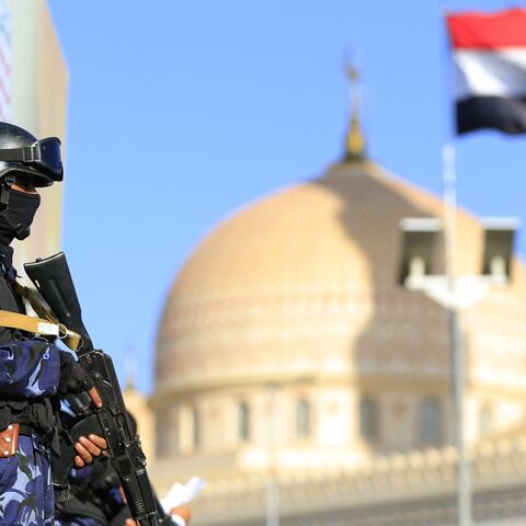 A security force member stands guard during a protest against Saudi intervention in Yemen, in Sanaa, on Oct. 9, 2026. 