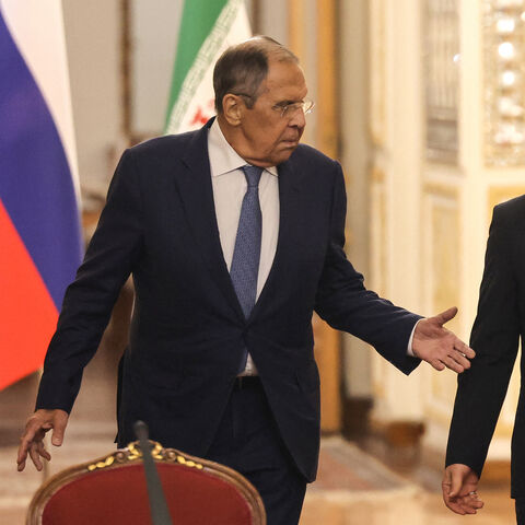 Russia's Foreign Minister Sergey Lavrov (L) and Iran's Foreign Minister Abbas Araghchi arrive to hold a press conference after a meeting in Tehran on October 19, 2026. The Russian foreign minister arrived in Iran on October 19, in his first visit since the outbreak of the Middle East war as Moscow seeks to play a mediating role. (Photo by ATTA KENARE / AFP via Getty Images)