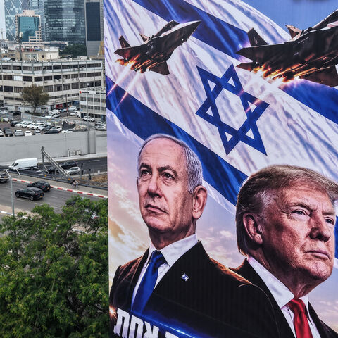 An aerial view shows a campaign billboard depicting Prime Minister Benjamin Netanyahu of the Likud party and US President Donald Trump in Tel Aviv on October 26, 2026, on the eve of the Israel's legislative elections.
