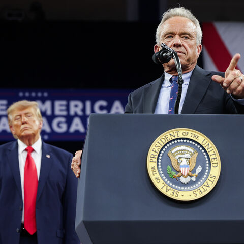 FORT MYERS, FLORIDA - OCTOBER 23: U.S. President Donald Trump (L) listens as U.S. Secretary of Health and Human Services Robert F. Kennedy Jr. speaks during an election rally at Alico Arena on the Florida Gulf Coast University campus on October 23, 2026 in Fort Myers, Florida. President Trump traveled to Florida to rally for local Republican candidates ahead of next week's midterm elections. (Photo by Alex Wong/Getty Images)