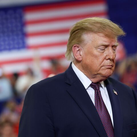 US President Donald Trump walks on stage
