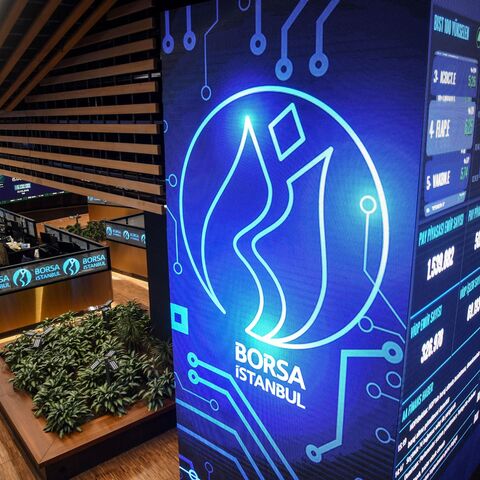 Traders work at their desks on the floor of the Borsa Istanbul
