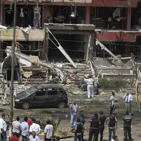 Policemen investigate the site of a bomb attack and assassination attempt near the house of Egypt's Interior Minister Mohamed Ibrahim in the Nasr City district of Cairo September 5, 2013. Ibrahim survived an assassination attempt unscathed on Thursday when a car bomb blew up his convoy and he said afterwards that a wave of terrorism by opponents of the military-installed government was just beginning. REUTERS/Amr Abdallah Dalsh (EGYPT - Tags: POLITICS CIVIL UNREST) - RTX138EV