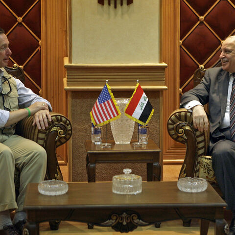 U.S. Representative Stephen Lynch (D-MA) (L) meets with Iraq's Deputy Foreign Minister Labid Abbawi (C) during his visit to Baghdad July 26, 2009. REUTERS/Hadi Mizban/Pool (IRAQ CONFLICT POLITICS) - GM1E57Q1IOY01