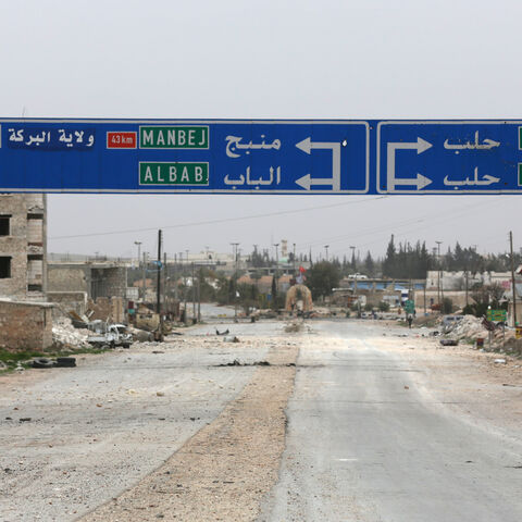 A road sign that shows the direction to Manbij city is seen in the northern Syrian town of al-Bab, Syria March 1, 2017. Picture taken March 1, 2017. REUTERS/Khalil Ashawi - RC15D78AB000