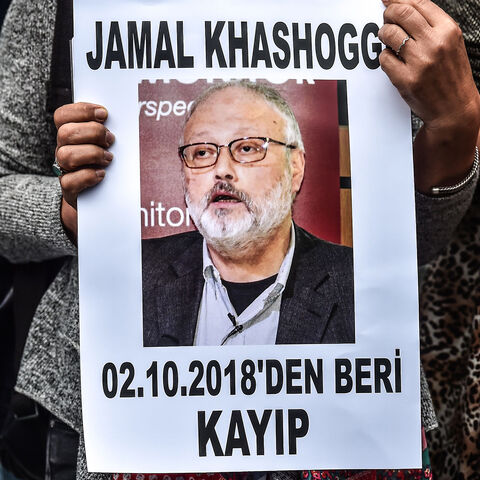 A woman holds a portrait of missing journalist and Riyadh critic Jamal Khashoggi reading "Jamal Khashoggi is missing since October 2" during a demonstration in front of the Saudi Arabian consulate on October 9, 2018 in Istanbul. - Khashoggi, a Washington Post contributor, vanished last on October 2 after entering the Saudi Arabian consulate to receive official documents ahead of his marriage to a Turkish woman. A Turkish government source told AFP at the weekend that the police believe the journalist "was k