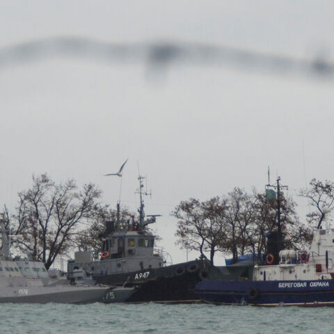 Three Ukrainian naval ships (L), which were recently seized by Russia's FSB security service, are seen anchored in a port in Kerch, Crimea November 28, 2018. REUTERS/Alla Dmitrieva - RC18F447FA20