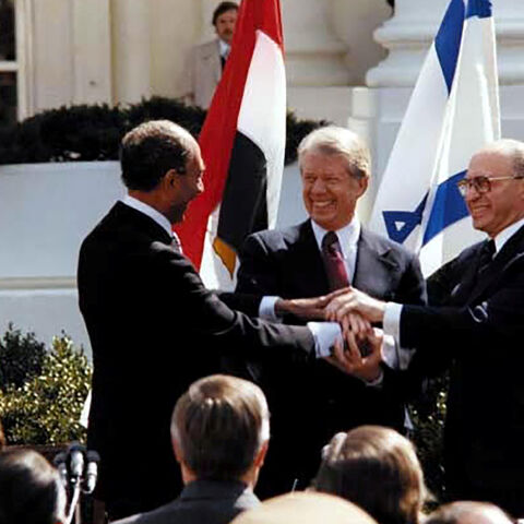 FILE PHOTO: U.S. President Jimmy Carter, Egyptian President Anwar Sadat and Israeli Prime Minister Menachem Begin join hands in celebration of the signing of the ÒTreaty of Peace Between the Arab Republic of Egypt and the State of IsraelÓ at the White House in Washington, D.C., March 26, 1979. Courtesy Jimmy Carter Library/National Archives/Handout via REUTERS/File Photo  ATTENTION EDITORS - THIS IMAGE WAS PROVIDED BY A THIRD PARTY.  PLEASE SEARCH "FROM THE FILES - 40TH ANNIVERSARY OF EGYPT-ISRAEL PEACE TRE
