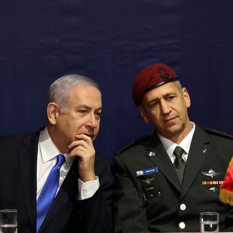 Israeli Prime Minister Benjamin Netanyahu speaks with incoming Israeli Chief of Staff Aviv Kohavi during a ceremony whereby he replaces Lieutenant-General Gadi Eizenkot, at the Defense Ministry in Tel Aviv, Israel January 15, 2019. REUTERS/Corinna Kern - RC116DA9AC60