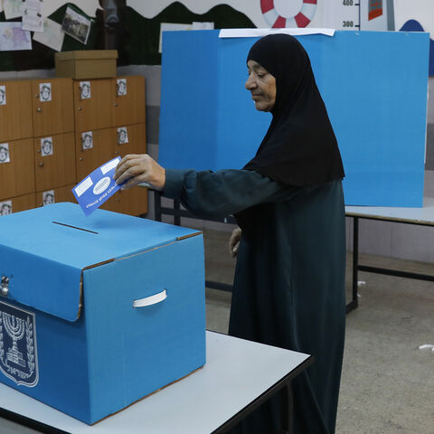 An Arab Israeli woman casts her vote during Israel's parliamentary elections on April 9, 2019 at a polling station in the northern Israeli town of Taiyiba. - Israelis voted today in a high-stakes election that will decide whether to extend Prime Minister Benjamin Netanyahu's long right-wing tenure despite corruption allegations or to replace him with an ex-military chief new to politics. (Photo by Ahmad GHARABLI / AFP)        (Photo credit should read AHMAD GHARABLI/AFP/Getty Images)