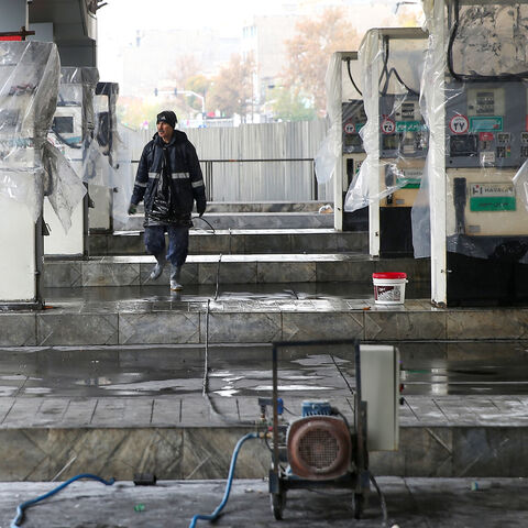 A man walks near the remains of gas pump stands, during protests against increased fuel prices, in Tehran, Iran November 20, 2019. Picture taken November 20, 2019. Nazanin Tabatabaee/WANA (West Asia News Agency) via REUTERS ATTENTION EDITORS - THIS IMAGE HAS BEEN SUPPLIED BY A THIRD PARTY - RC2CGD9I6P5F